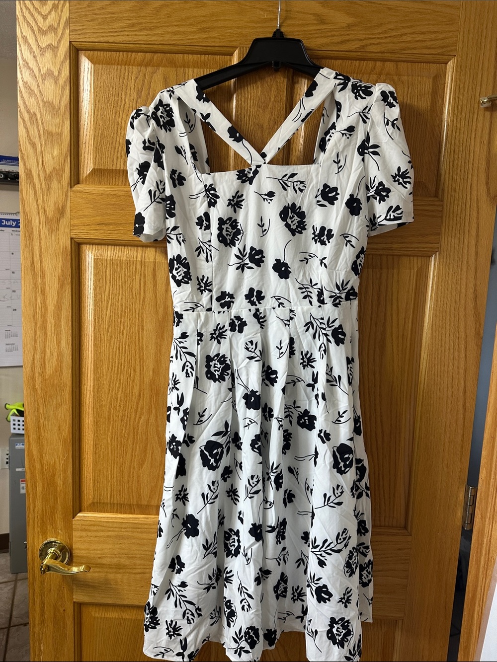 chic White Dress with Black Floral Accents